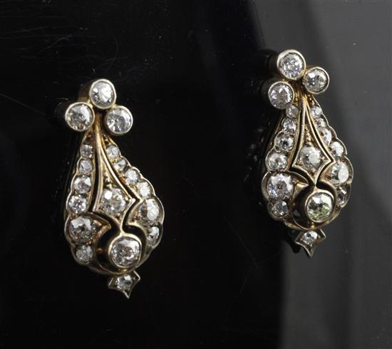 A pair of late 19th century gold, silver and diamond pear shaped earrings, 1in.